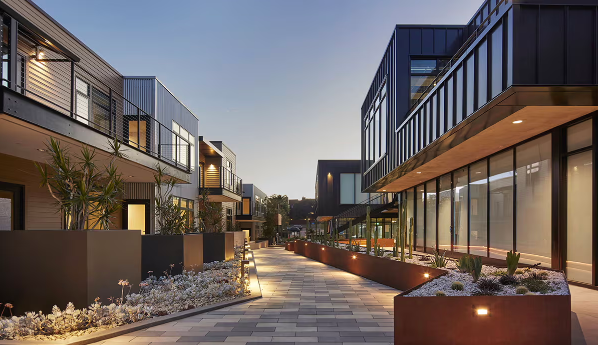 Powder-coated and Corten steel planters in a mixed-use space