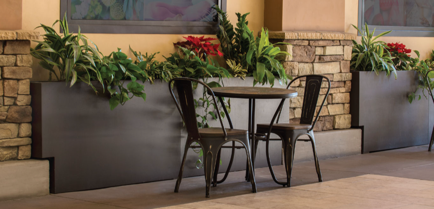 Table and Chairs with planter in background